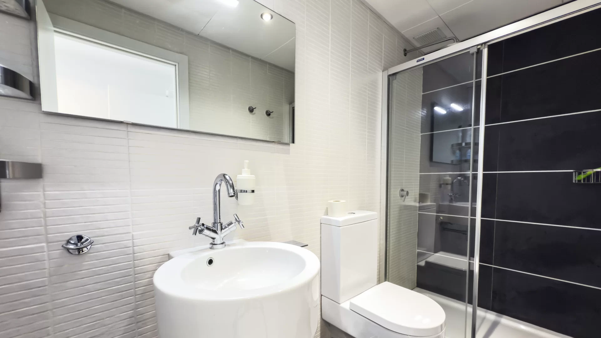 Second bathroom with walk in shower at Las Olas luxury apartment
